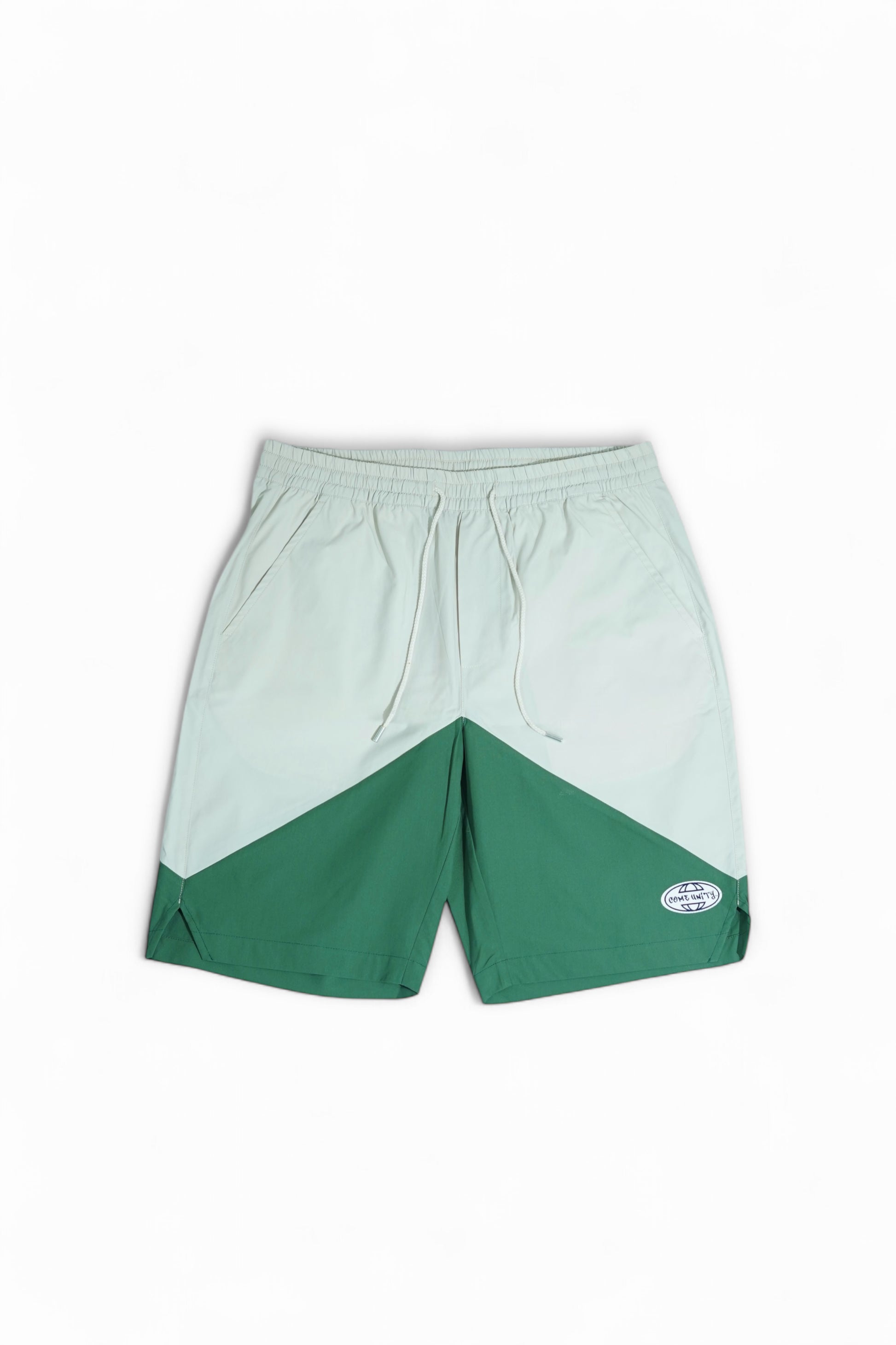 COMEUNITY Cut Sew Shorts White & Green on a white background